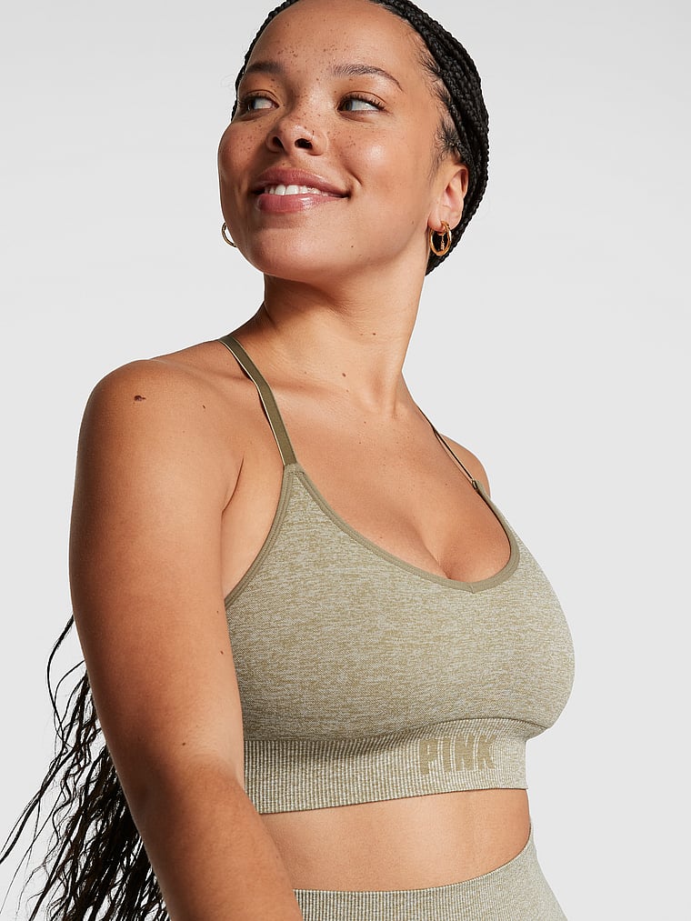 PINK Seamless Racerback Sports Bra, Dusted Olive Marl, onModelFront, 1 of 4 Eden is 5'8" or 173cm and wears 34DD (E) or Large